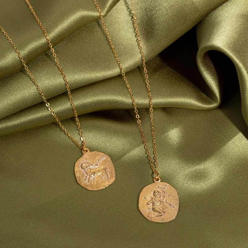 Lot - A 14k gold Sagittarius pendant on a 14k gold collar